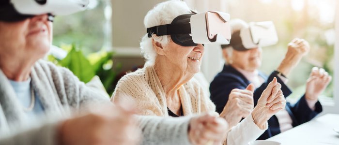 Shot of happy senior women using virtual reality headsets together at a retirement home